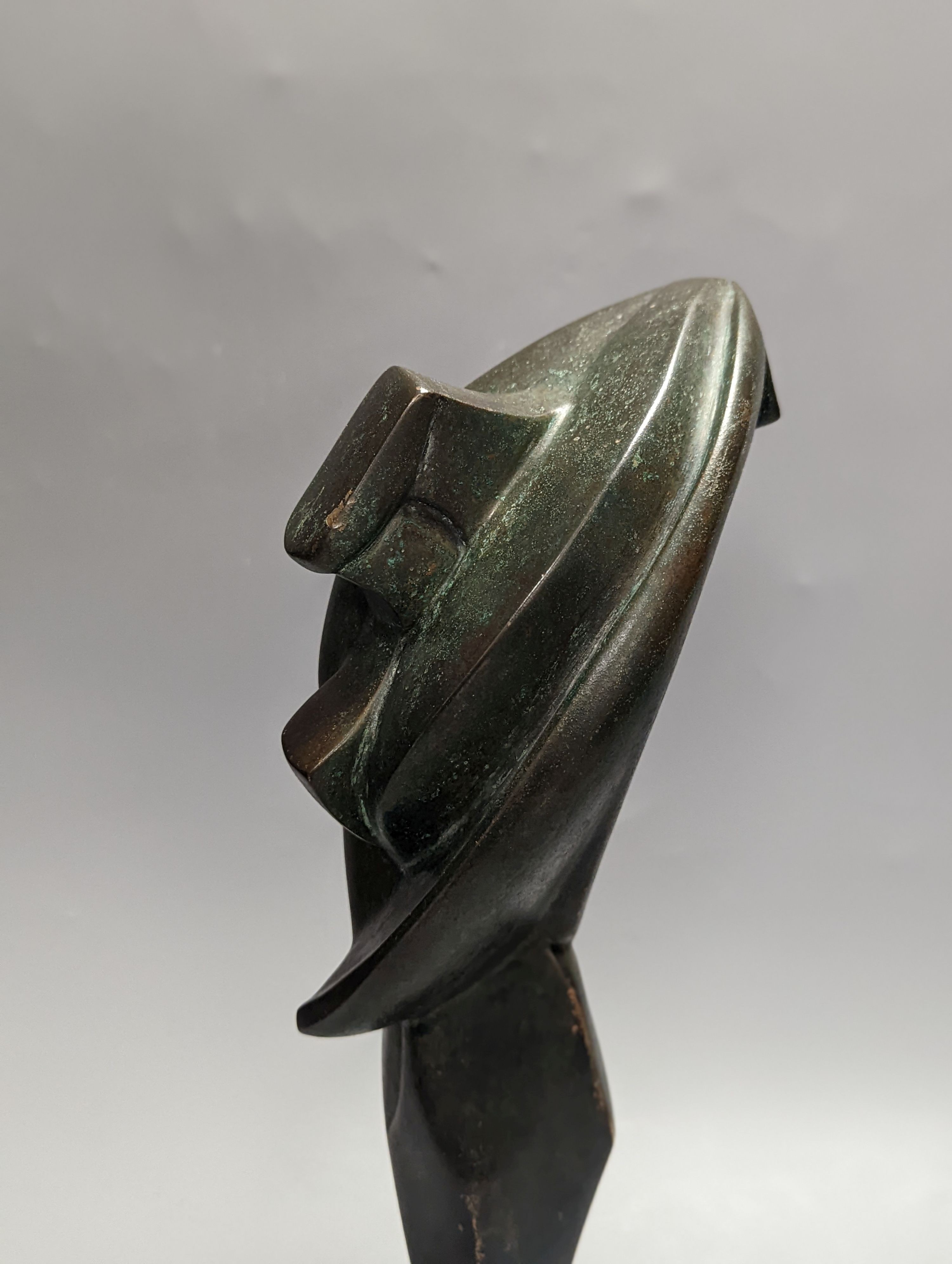 A 20th century Futurist style patinated bronze sculpture, unsigned. 40cm